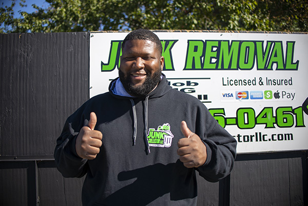 A happy junk removal worker
